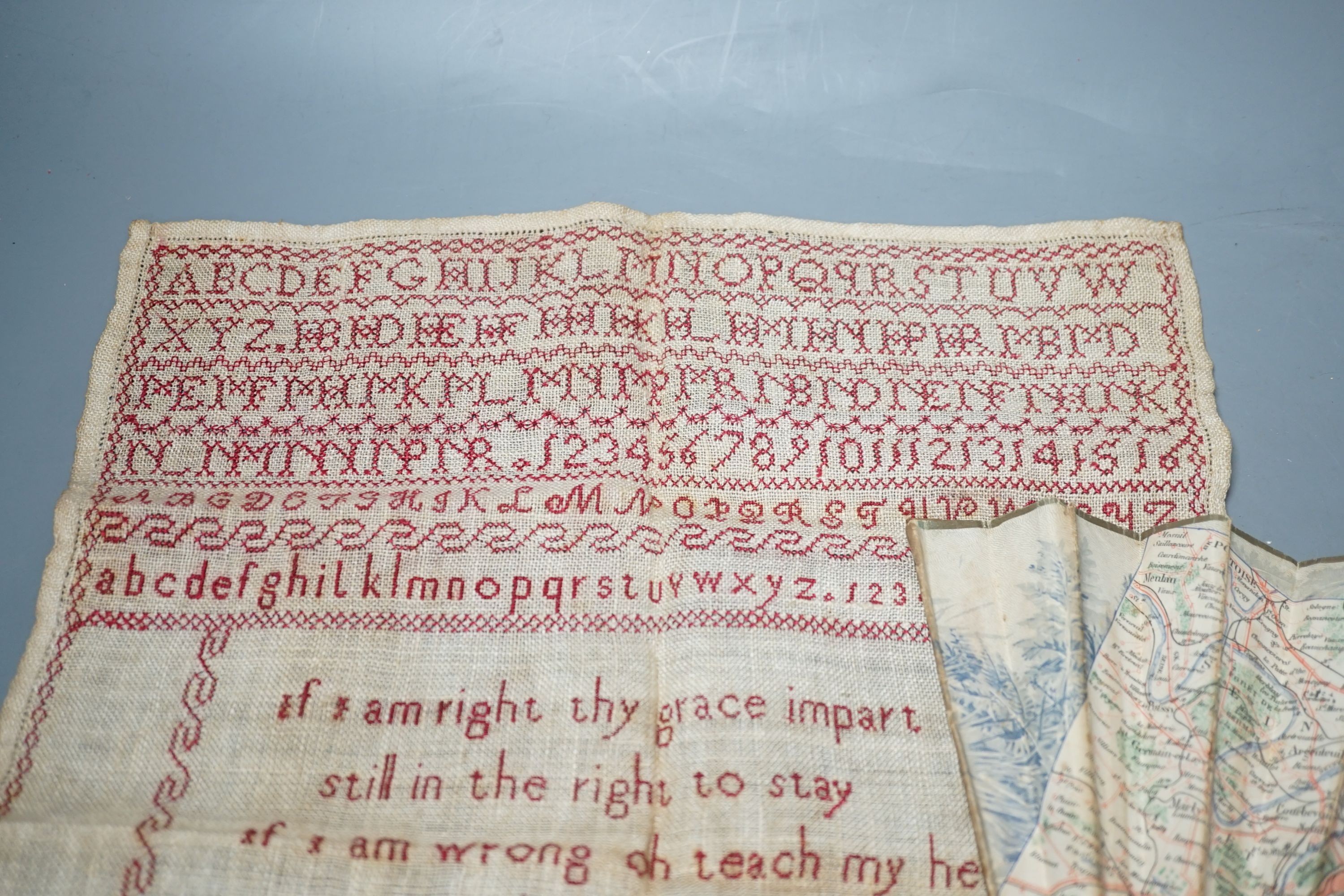 A 19th century Cycling Map of Paris fan and an 1814 cross stitch sampler